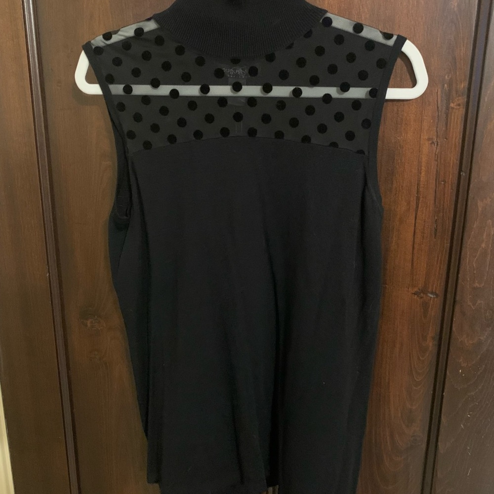 Black sleeveless top.  Sheer on top with cute polka dots.